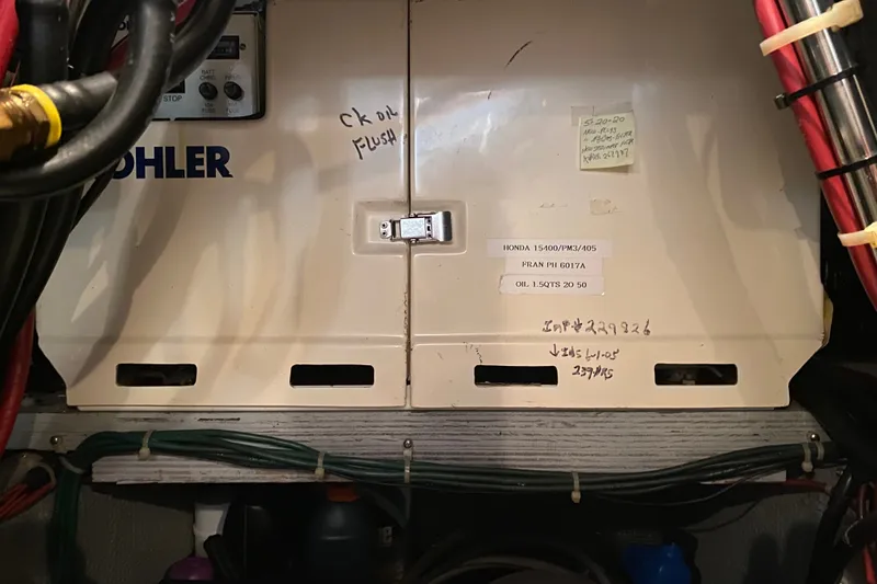 Slide: The Image of Engine compartment of a 1995 Silverton 41 Convertible with Kohler generator. - 25