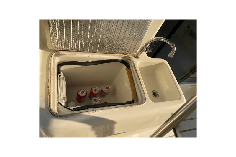Slide: The Image of 1995 Silverton 41 Convertible boat sink and cooler with beverage cans. - 7