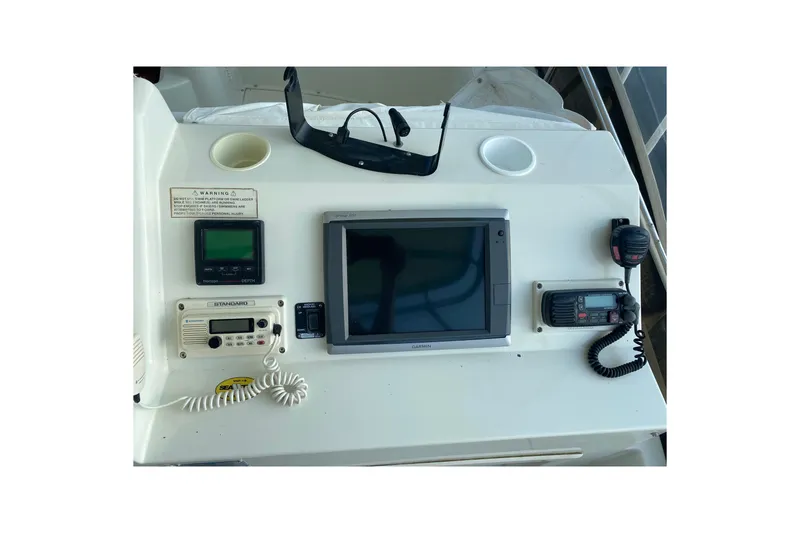 Slide: The Image of Control panel of a 1995 Silverton 41 Convertible boat with navigation equipment. - 5
