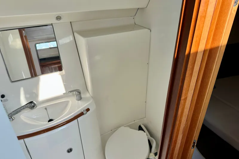 Slide: The Image of Bathroom interior of 2004 Beneteau Oceanis Clipper 393 yacht, featuring sink and mirror. - 23