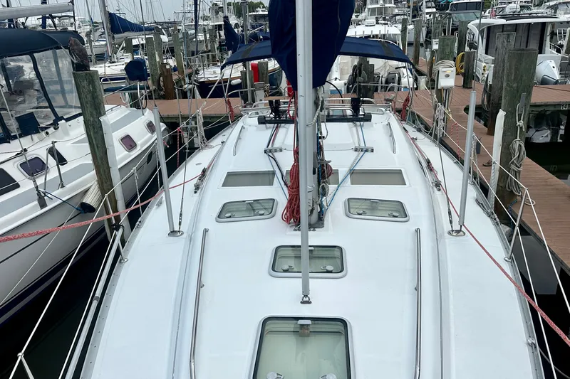 Slide: The Image of 2004 Beneteau Oceanis Clipper 393 sailboat docked at marina, top deck view. - 14