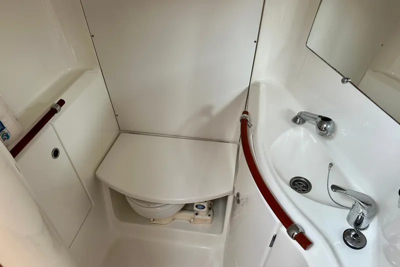 Slide: The Image of Bathroom interior of 2004 Beneteau Oceanis Clipper 393 yacht, featuring sink and toilet. - 22