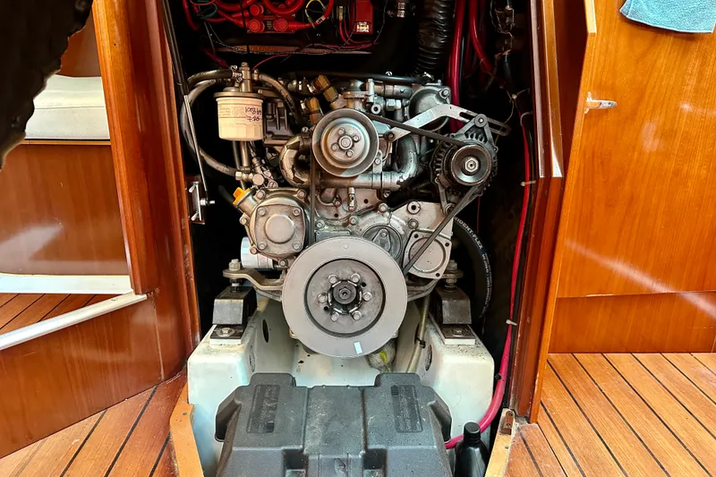 Slide: The Image of Engine compartment of a 2004 Beneteau Oceanis Clipper 393 sailboat, showcasing mechanical details. - 24