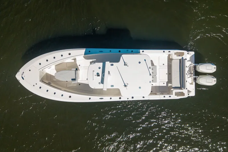 Slide: The Image of Aerial view of 2025 SeaVee 322Z boat on water, showcasing sleek design and twin engines. - 3