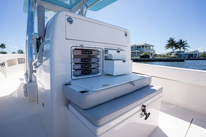 Slide: The Image of 2025 SeaVee 322Z boat interior with storage compartments and seating, dockside view. - 10