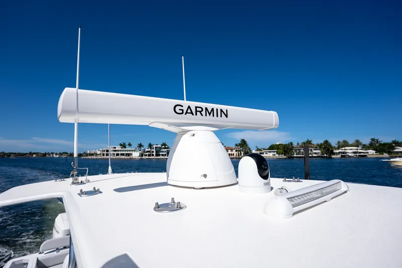 Slide: The Image of 2025 SeaVee 322Z boat with Garmin radar on a sunny day. - 11