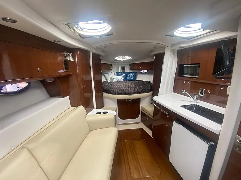 Slide: The Image of Interior of the 2018 Four Winns 355 Vista with elegant furnishings and modern amenities. - 15