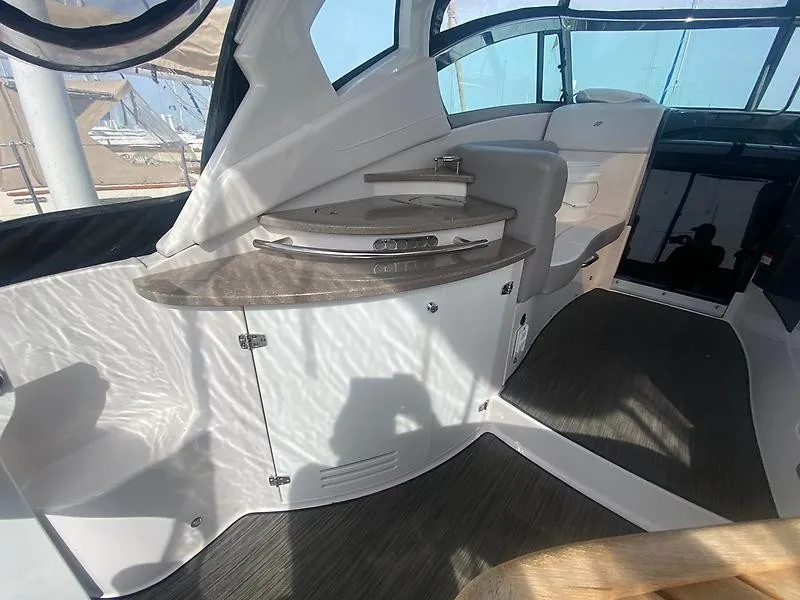 Slide: The Image of The image shows the interior of a 2018 Four Winns 355 Vista with sleek surfaces and modern design. - 1