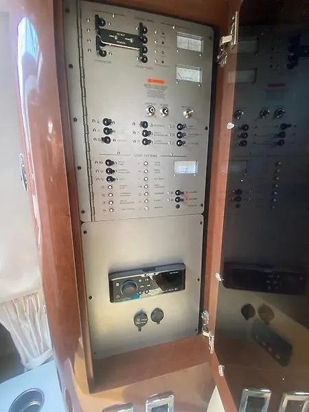 Slide: The Image of Electrical panel on a 2018 Four Winns 355 Vista, featuring switches and controls. - 20