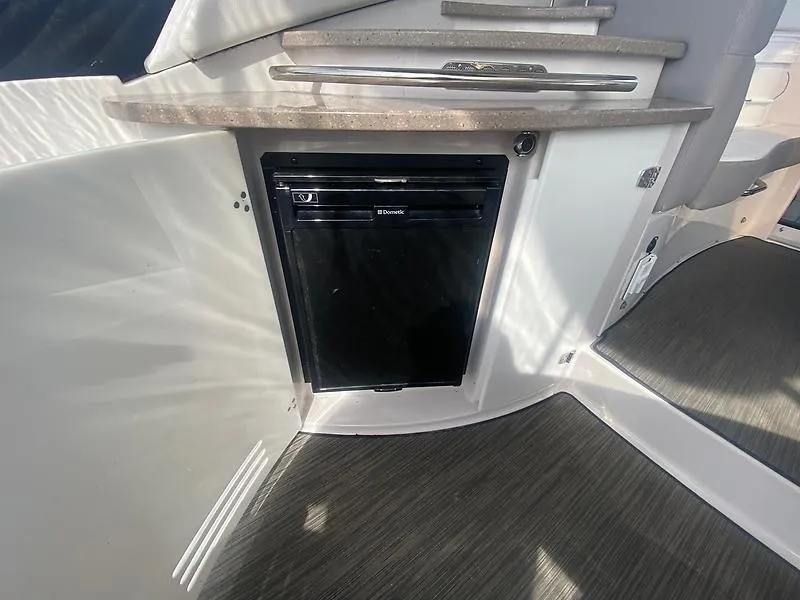 Slide: The Image of Galley area of the 2018 Four Winns 355 Vista with built-in refrigerator. - 9