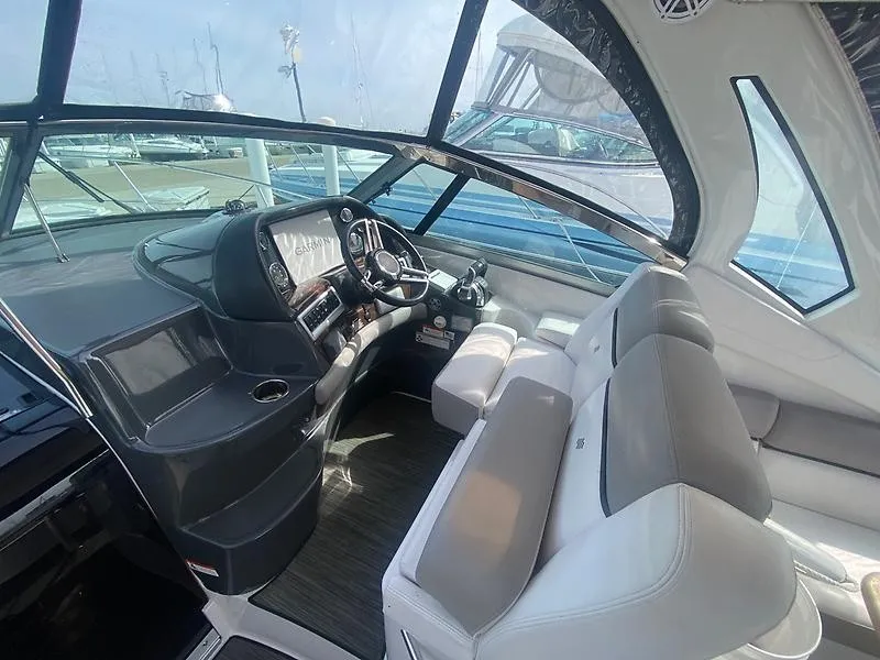 Slide: The Image of The image shows the cockpit of a 2018 Four Winns 355 Vista with modern instruments and comfortable seating. - 2