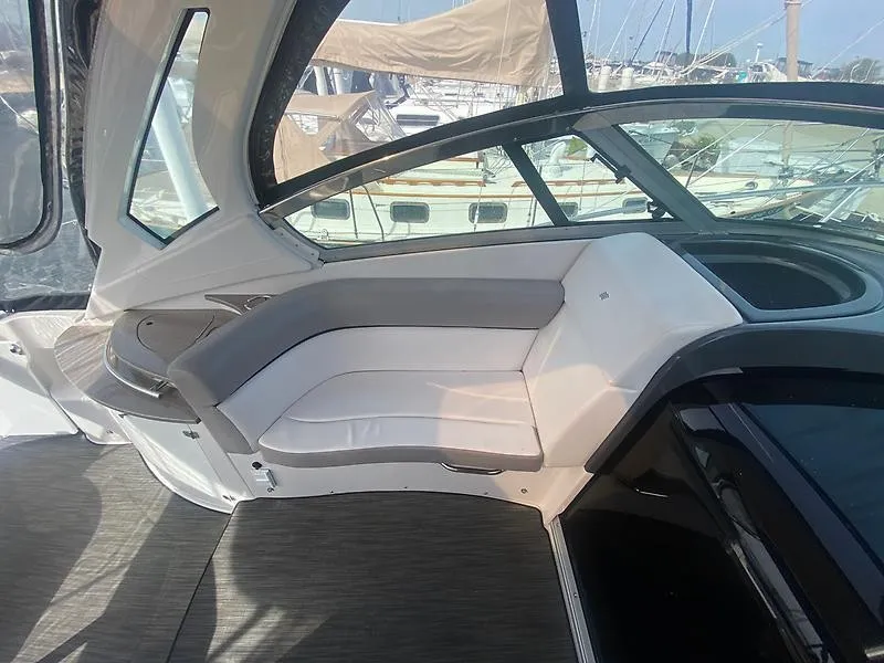 Slide: The Image of Interior of a 2018 Four Winns 355 Vista with gray and white seating. - 10