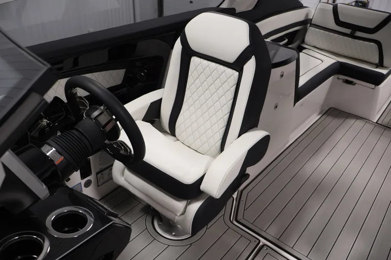 Slide: The Image of Luxurious interior of 2026 Yamaha Boats 275SE, featuring sleek seating and modern design. - 25