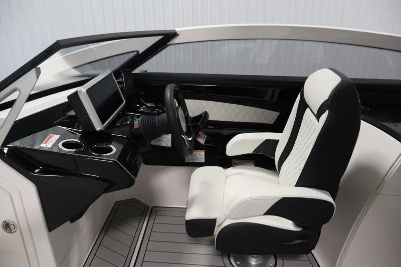 Slide: The Image of 2026 Yamaha Boats 275SE cockpit with modern steering, touchscreen, and luxurious seating. - 17