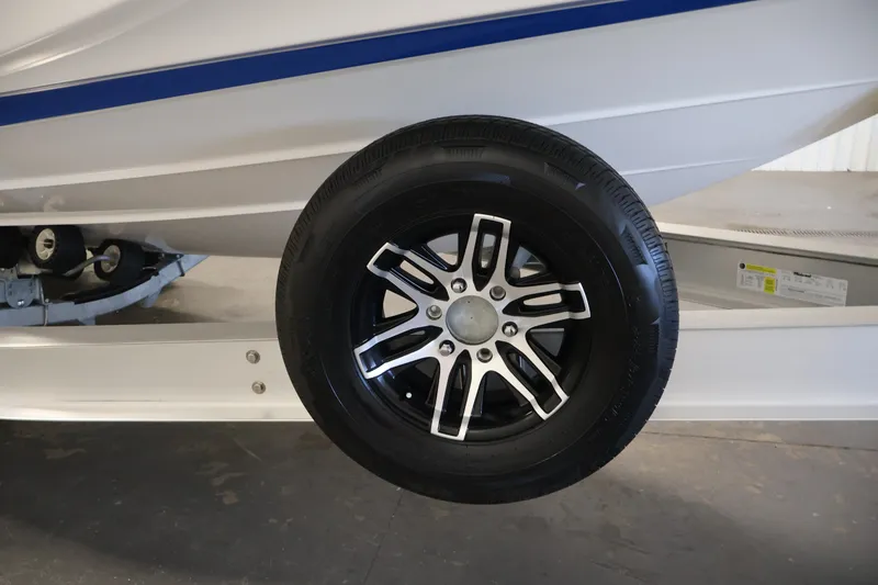 Slide: The Image of Trailer wheel of 2026 Yamaha Boats 275SE, showcasing sleek design and sturdy construction. - 48