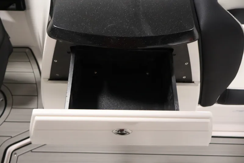 Slide: The Image of Open storage compartment on 2026 Yamaha Boats 275SE, featuring sleek design and functionality. - 31