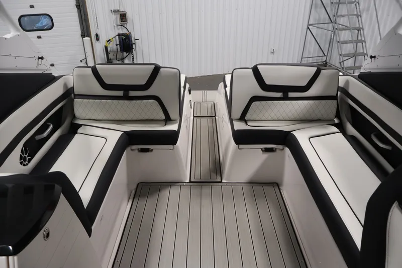 Slide: The Image of Interior of 2026 Yamaha Boats 275SE, featuring sleek white and black seating. - 34
