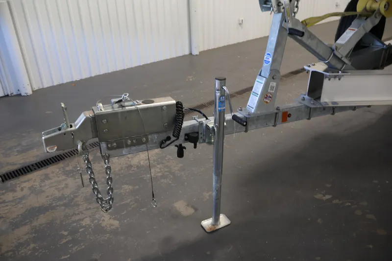 Slide: The Image of Trailer hitch of a 2026 Yamaha Boats 275SE in a garage setting. - 47