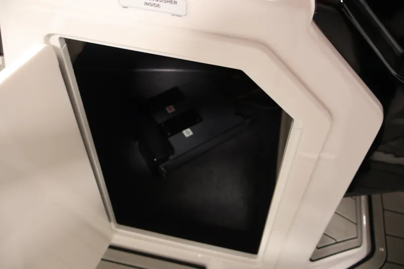 Slide: The Image of Open storage compartment on 2026 Yamaha Boats 275SE, showcasing interior space. - 16