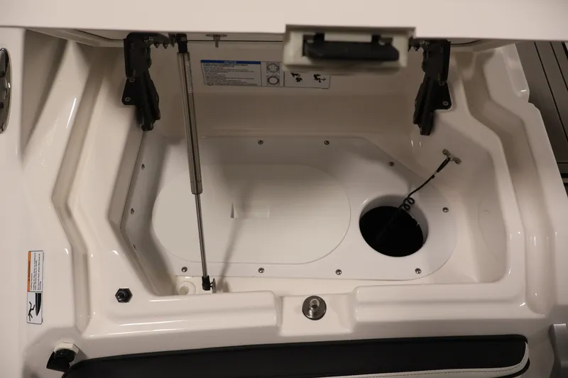 Slide: The Image of Open storage compartment of 2026 Yamaha Boats 275SE, showcasing interior details and design. - 43
