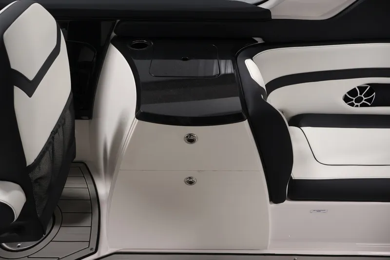 Slide: The Image of 2026 Yamaha Boats 275SE interior with sleek black and white seating and modern design. - 30