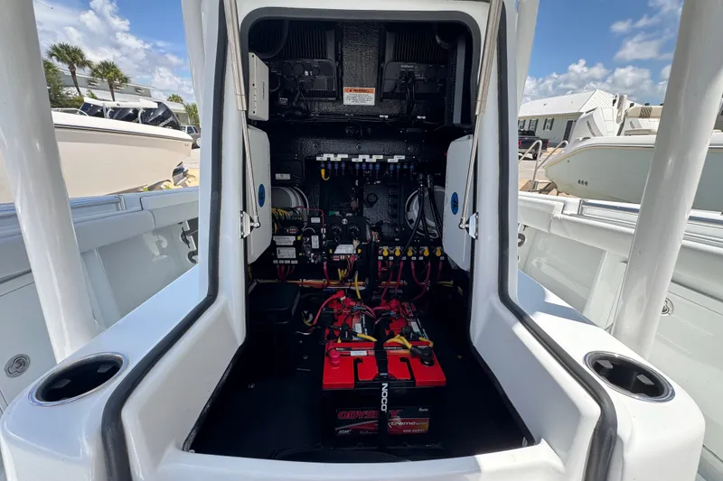 Slide: The Image of Electrical system inside a 2027 Yellowfin 26 Hybrid boat, showcasing batteries and wiring. - 15