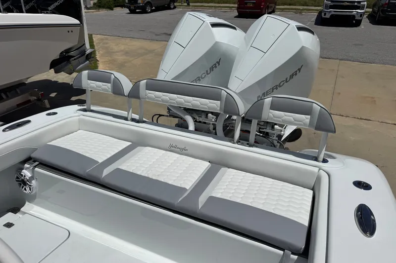 Slide: The Image of 2027 Yellowfin 26 Hybrid boat with dual Mercury engines, featuring cushioned seating. - 20