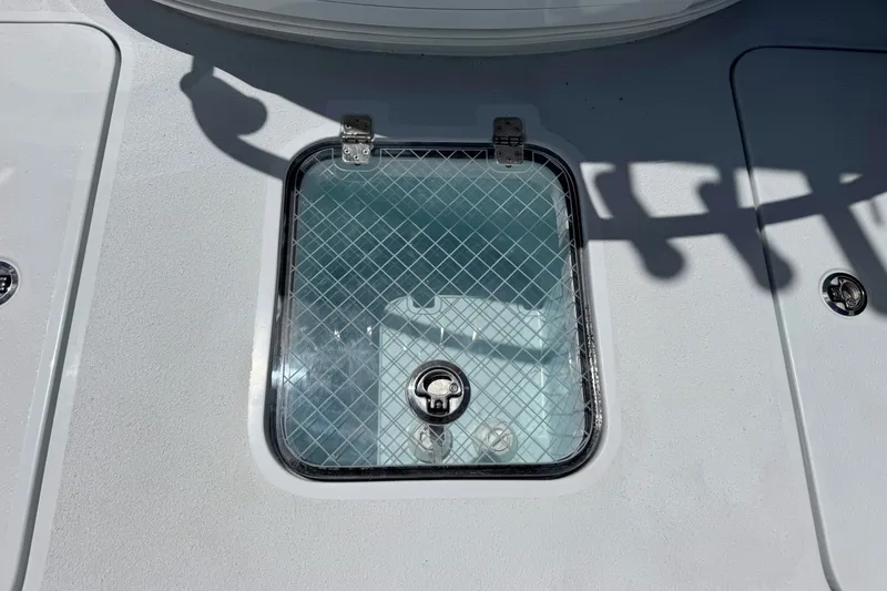 Slide: The Image of Hatch on 2027 Yellowfin 26 Hybrid boat deck, featuring a secure latch. - 22
