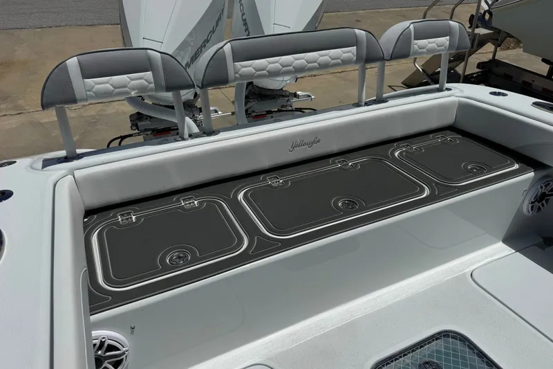 Slide: The Image of 2027 Yellowfin 26 Hybrid boat interior with seating and storage compartments. - 24