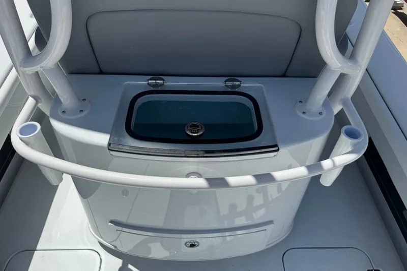 Slide: The Image of 2027 Yellowfin 26 Hybrid boat console with rod holders and storage compartment. - 21
