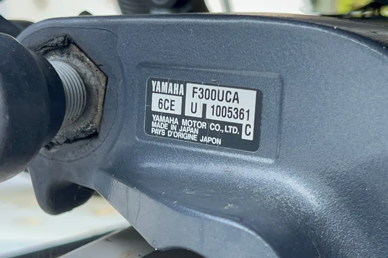 Slide: The Image of Close-up of Yamaha F300UCA engine label on 2012 Robalo R247 Dual Console boat. - 44