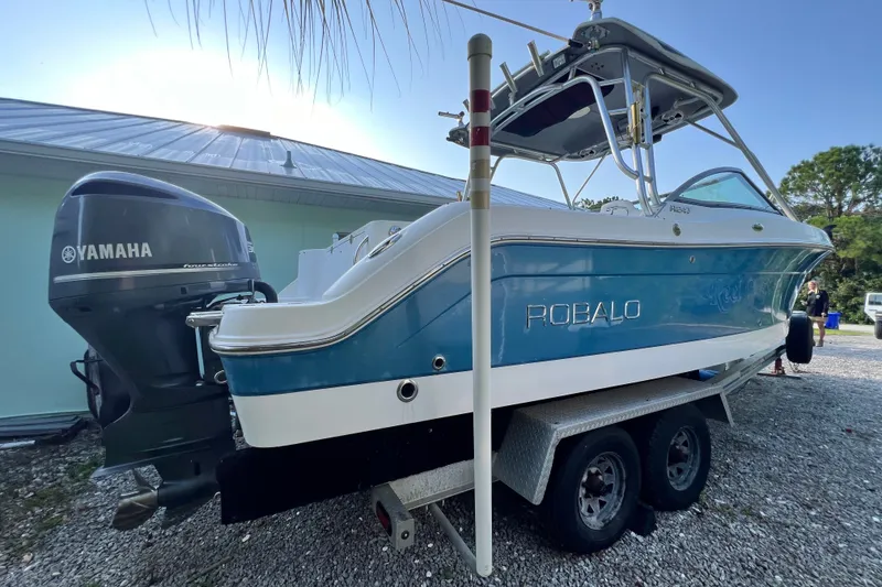 Slide: The Image of 2012 Robalo R247 Dual Console boat with Yamaha engine on trailer. - 9