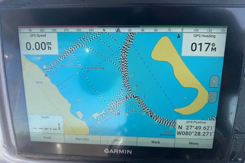 Slide: The Image of Garmin GPS display on 2012 Robalo R247 Dual Console, showing navigation map and coordinates. - 26