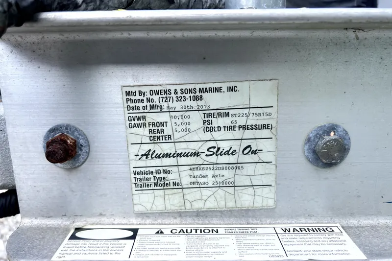 Slide: The Image of Label on Owens & Sons Marine trailer, detailing specifications and manufacturing information. - 43