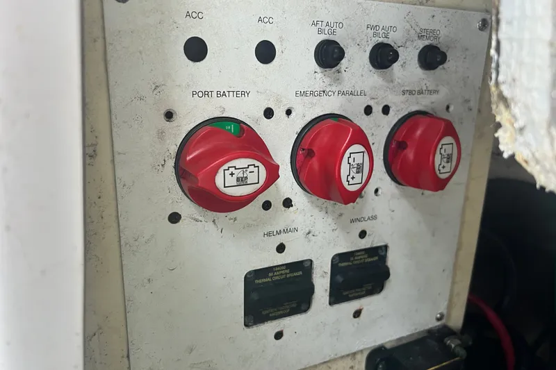 Slide: The Image of Control panel of a 2012 Robalo R247 Dual Console boat with battery switches. - 39