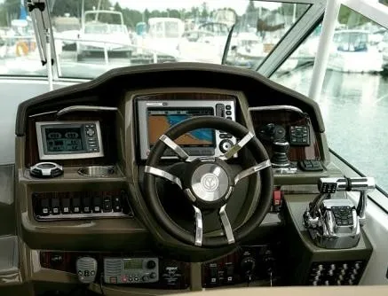 Slide: The Image of Helm of the 2017 Cruisers Yachts 350 Express with modern navigation equipment and controls. - 34