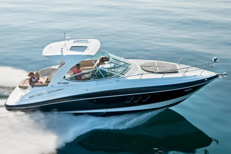 Slide: The Image of A 2017 Cruisers Yachts 350 Express speeding over calm water. - 33