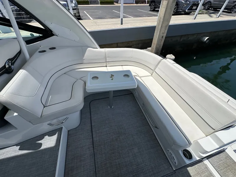 Slide: The Image of The 2017 Cruisers Yachts 350 Express features an elegant white seating area with a small table. - 25