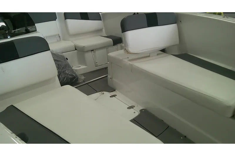 Slide: The Image of Interior seating of 2026 Tahoe T16 boat, featuring white and gray cushioned seats. - 8