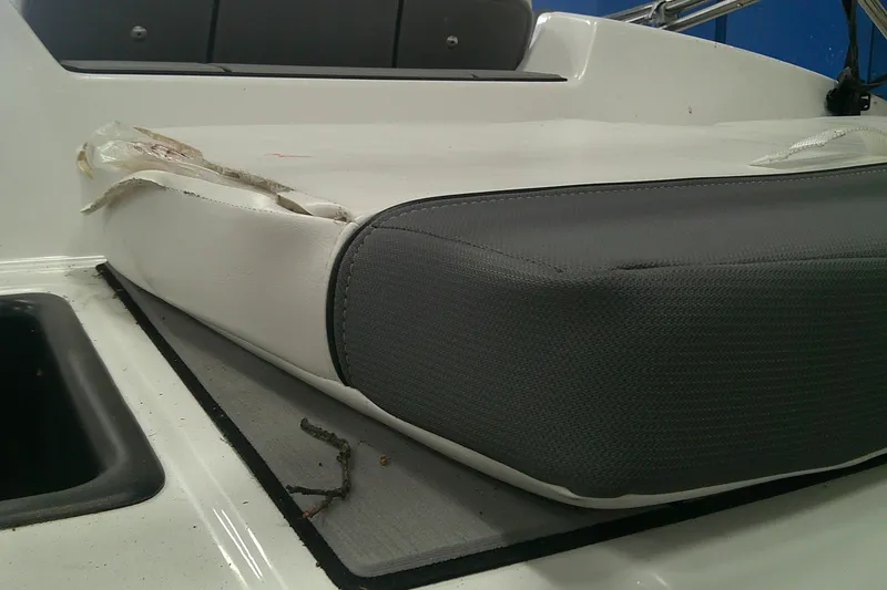 Slide: The Image of Damaged seat cushion on a 2026 Tahoe T16 boat, showing wear and tear. - 3