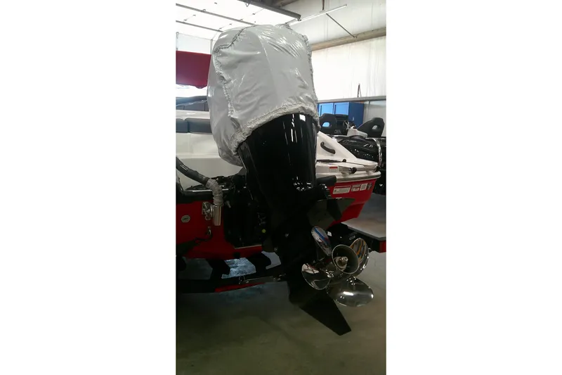 Slide: The Image of 2026 Tahoe T18 boat with covered outboard motor in a garage setting. - 5