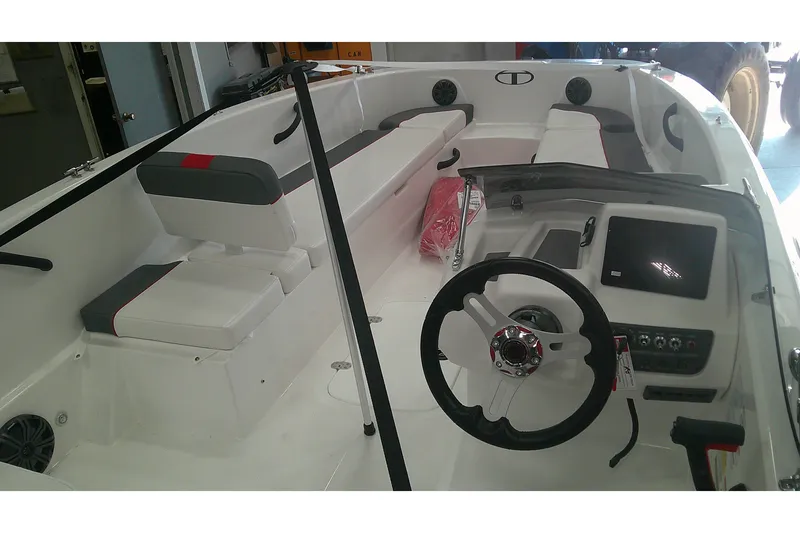 Slide: The Image of 2026 Tahoe T18 boat interior with steering wheel and seating arrangement. - 6