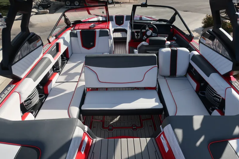 Slide: The Image of 2019 Nautique Super Air Nautique G23 interior with red and white upholstery, showcasing luxury seating. - 30