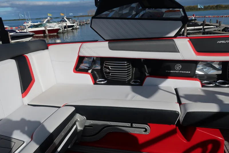 Slide: The Image of 2019 Nautique Super Air Nautique G23 interior with sleek seating and modern design. - 19