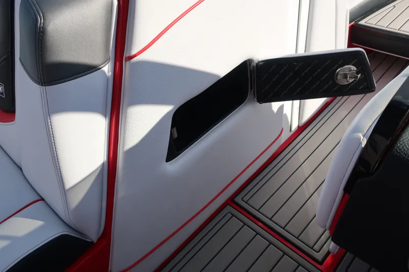 Slide: The Image of 2019 Nautique Super Air Nautique G23 interior with sleek upholstery and storage compartment. - 32