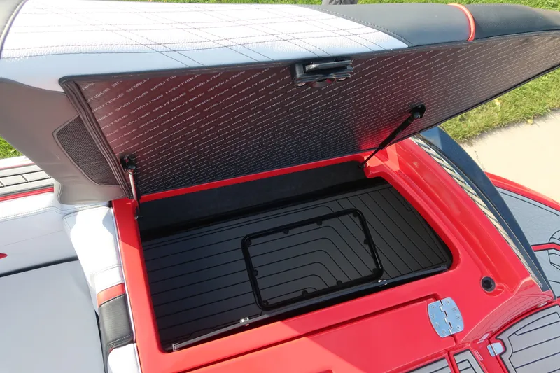 Slide: The Image of Open storage compartment in 2019 Nautique Super Air Nautique G23 boat. - 11