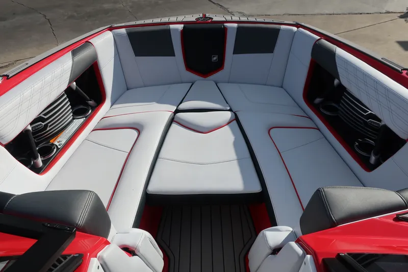 Slide: The Image of 2019 Nautique Super Air Nautique G23 boat interior with red and white seating. - 5