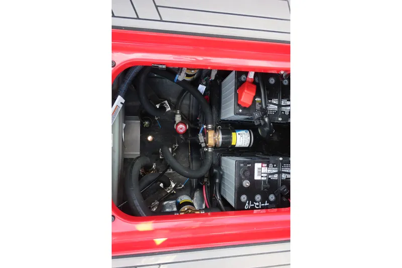 Slide: The Image of Engine compartment of 2019 Nautique Super Air Nautique G23 with visible batteries and wiring. - 28