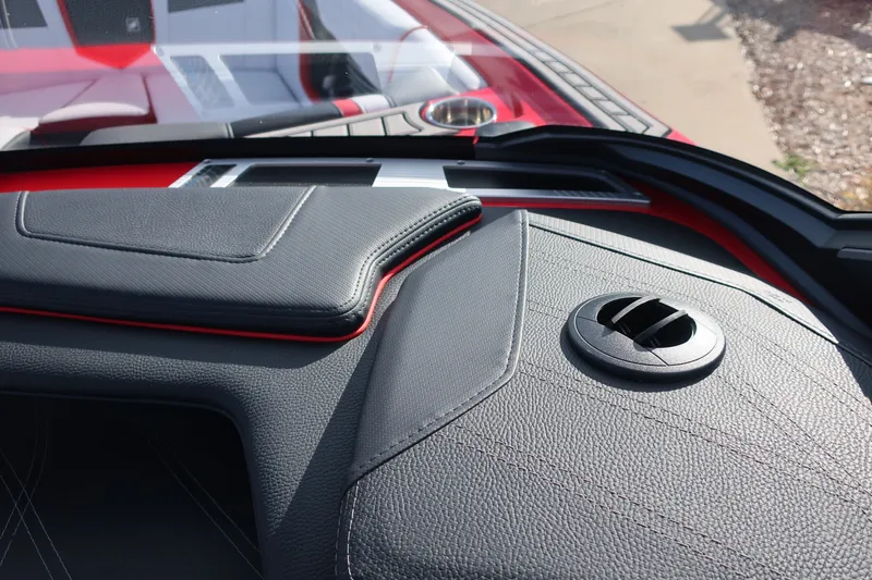 Slide: The Image of 2019 Nautique Super Air Nautique G23 dashboard with sleek black and red design. - 24