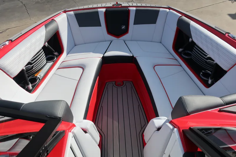 Slide: The Image of 2019 Nautique Super Air Nautique G23 boat interior with red and white seating. - 35